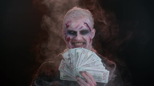 Scary Sinister Halloween Zombie Wounded Undead Man with Money Dollar Cash Banknotes Smiles Terribly