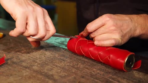Crafting Red Leather Design with Skilled Hands