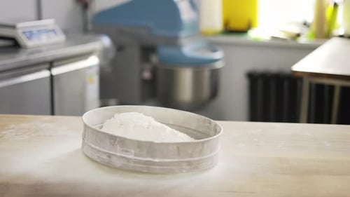 Close Up Hands Putting Flour in a Sieve at the Kithen
