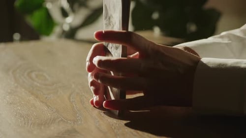 Handheld Close Up of Caucasian Woman Hands Counting Money in 100 Dollar Bill Banknote