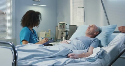 Doctor Visiting Patient in Hospital