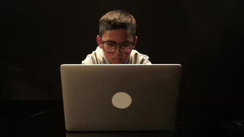 Boy Using Laptop Hacking