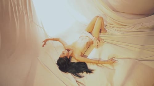 Glamorous Woman Posing in Silky Tent