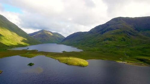 Lake surrounded by beautiful mountains 4k