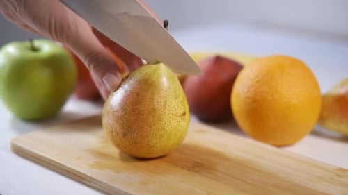 Pear Sliced on Wooden Cutting Board