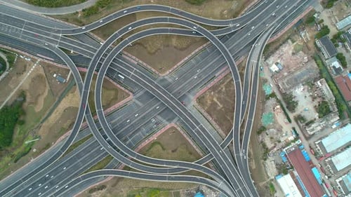 Top View to the Cars Driving on Multilevel Highway on the Sunset