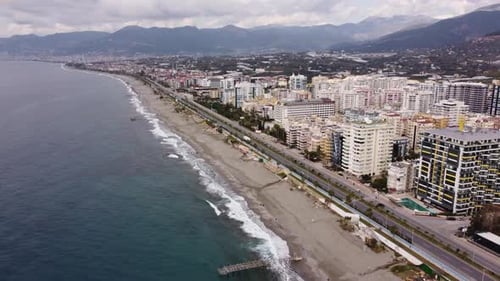 Aerial View Flying over the Resort Town Near the Embankment and the Mediterranean Sea