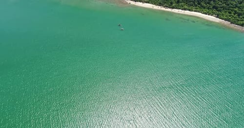 Aerial view drone shot of turquoise sea water and beach at the island