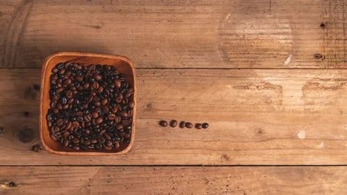 Coffee Beans Spell Coffee on Wooden Table
