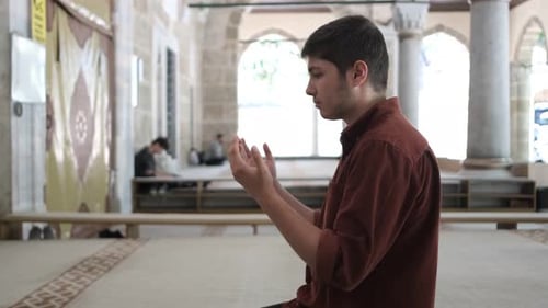 Youth Muslim Praying With His Hand