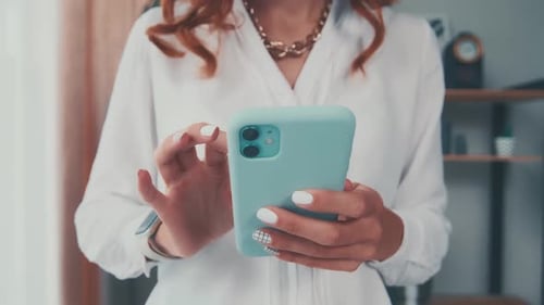 Close Up of Caucasian Woman Hold Cellphone Typing Message Using Internet