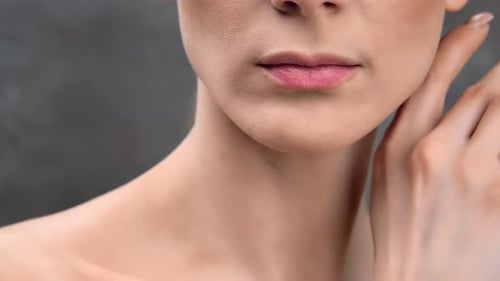Woman Touches Her Neck Close Up