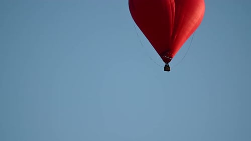 Red Heart Shaped Hot Air Balloon Flying
