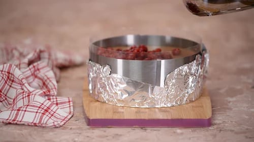 Pouring the Jelly Mixture Over the Cherry Cake