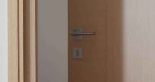 Turning a Doorknob to Open a Door