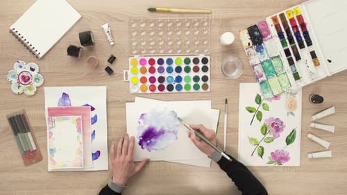 Watercolor Painting with Paint Brush on Paper