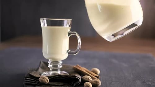 Traditional holiday drink egg nog garnished with nutmeg.
