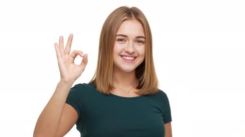 Young Woman Giving Okay Sign and Smiling