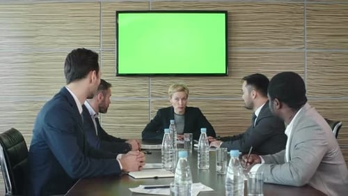 Business Team Meeting in Modern Office with Green Screen