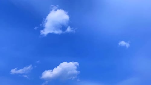 Clouds Drifting in a Bright Blue Sky