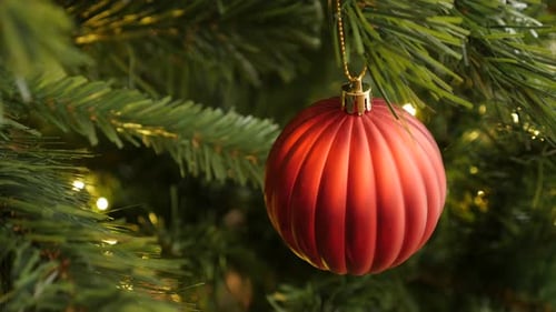 Detailed red Christmas ornament close-up 4K 2160p 30fps UltraHD footage - Shiny bauble hanged on the