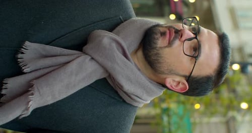 Portrait of a Handsome Businessman in Glasses Standing on the Street Background. Close Up Face of