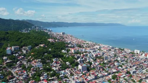 Aerial View of a Coastal City, Ocean and Mountains