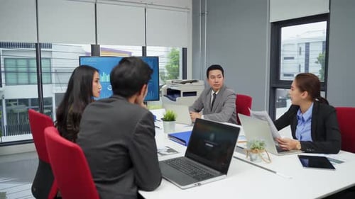 Asian young business people group have discussion meeting and brainstorm about technology in office