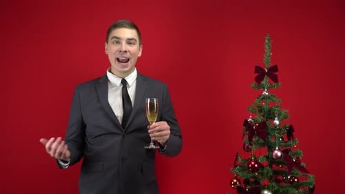 Cheerful Man in Suit Toasting to Christmas Holiday