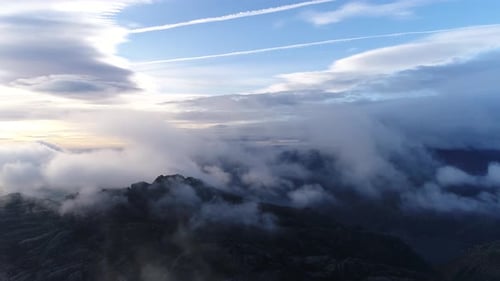 Aerial View of Mountains and Clouds at Sunrise