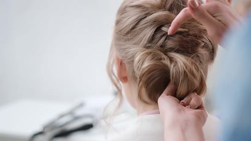 Close Up Female Hairdresser Hands Fixing Plaiting Hairstyle Using Barrette