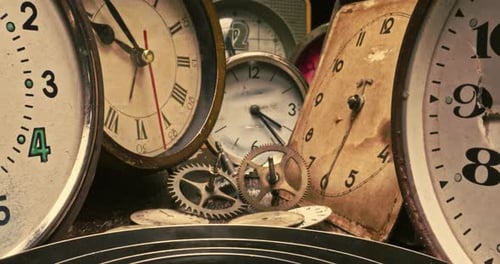 Ruined clocks with watchmakers workshop. Watchmakers workshop with spare parts.