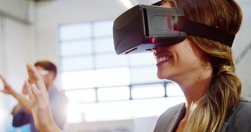 Woman Enjoys Virtual Reality Experience in Office