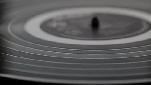 Vinyl Record Spinning on Turntable Close Up