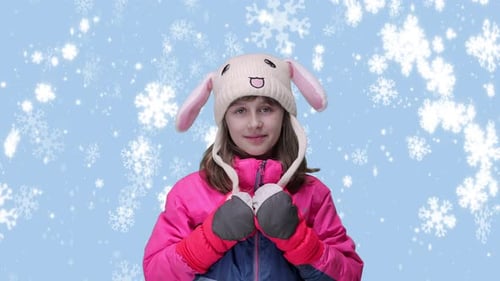 Smiling Girl in Winter Wonderland with Snowflakes