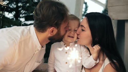 Loving Family Celebrates Christmas with Sparklers