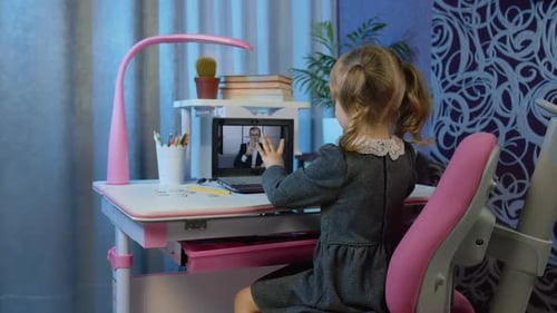 Child Enjoys Online Lesson with Male Teacher