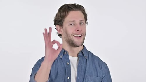 Man Gives OK Hand Gesture on White Background