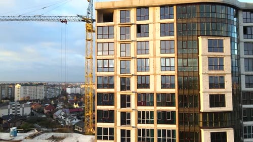 Aerial view of high residential apartment building under construction. Real estate development
