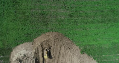 A Crawler Tractor Pushes The Ground With A Bucket Top View