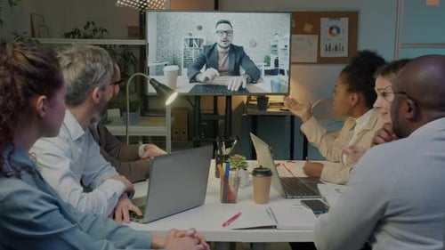 Corporate Team Meeting Via Video Conference in Office