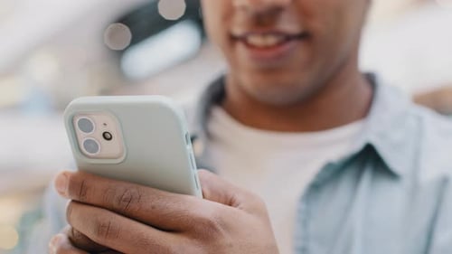 Young Adult Using Smartphone in Urban Setting