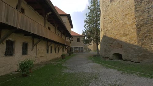 A path by a medieval building inside a fortress