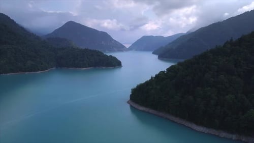 Aerial Flythrough of Beautiful Lake and Mountains. Inguri in Georgia