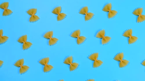 Bow Tie Pasta Pattern on Light Blue Background