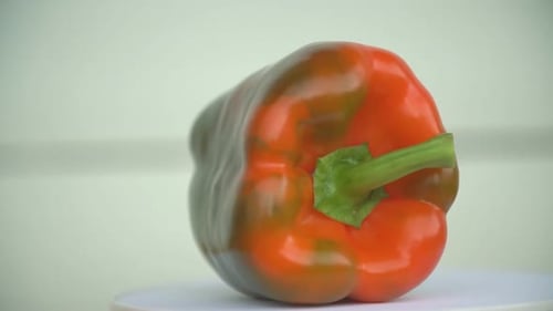 Green-orange Pepper on the Table