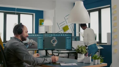 Mecanic Technician Working on Cad Software Using Computer