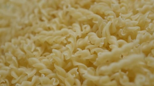 Falling on top pieces of famous Italian food close-up 4K 2160p 30fps UltraHD footage - Corkscrew sha