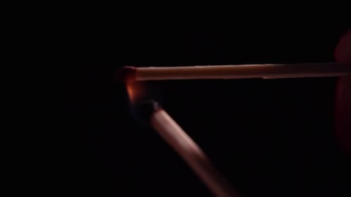 Match Igniting in Dark, Fiery Close-Up