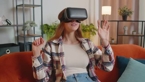 Young Woman Using Virtual Reality Headset on Couch